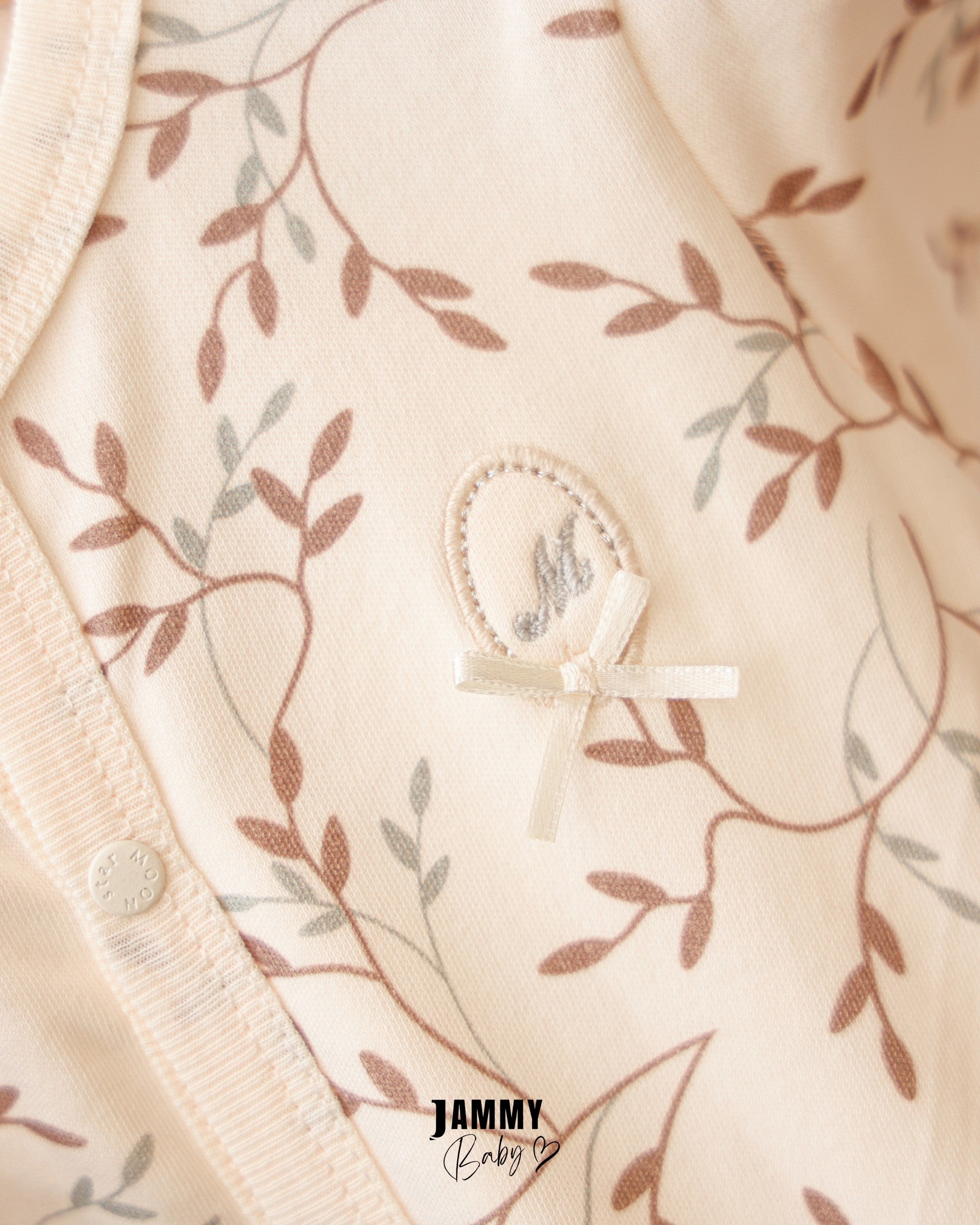 Botanical Footed Baby Romper – Cream
